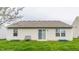 Home's back exterior with tidy yard, slider, and potential for outdoor enjoyment at 1681 Copeland Farms Dr, Greenfield, IN 46140