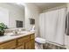 This bathroom features a vanity, sink, toilet, and shower with a shower curtain at 1681 Copeland Farms Dr, Greenfield, IN 46140