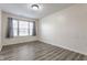 This bedroom boasts wood-look floors and a brightly lit window at 1681 Copeland Farms Dr, Greenfield, IN 46140