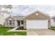 Charming single Gathering home with brick and siding, attached garage and freshly mulched landscaping at 1681 Copeland Farms Dr, Greenfield, IN 46140