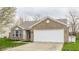 Charming single Gathering home with brick and siding, attached garage and freshly mulched landscaping at 1681 Copeland Farms Dr, Greenfield, IN 46140