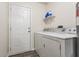 The laundry room has a washer and dryer and a door leading outside at 1681 Copeland Farms Dr, Greenfield, IN 46140