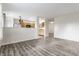 Open concept living room that looks into the kitchen with stainless steel appliances at 1681 Copeland Farms Dr, Greenfield, IN 46140