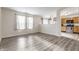 Open concept living room that looks into the kitchen with stainless steel appliances at 1681 Copeland Farms Dr, Greenfield, IN 46140
