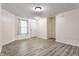 Bright living room with neutral walls, wood-look floors, and natural light at 1681 Copeland Farms Dr, Greenfield, IN 46140