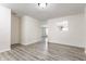 Bright living room with neutral walls and modern, wood-look floors at 1681 Copeland Farms Dr, Greenfield, IN 46140