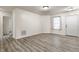 Bright living room with neutral walls, wood-look floors, and natural light at 1681 Copeland Farms Dr, Greenfield, IN 46140