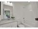 Bright bathroom featuring white cabinets, a gray countertop, and a shower/tub combo at 19452 Lewis Cir, Westfield, IN 46074
