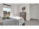 Bedroom view with gray dinosaur themed decor, gray dresser, and a bright window view at 19452 Lewis Cir, Westfield, IN 46074