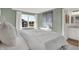 Calming bedroom featuring soothing green walls, large window, and a view to an ensuite bathroom at 19452 Lewis Cir, Westfield, IN 46074