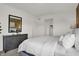 Bedroom featuring a dresser with dark wood finish, a large mirror, and cozy decor at 19452 Lewis Cir, Westfield, IN 46074