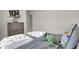 Bedroom with dinosaur decor, featuring gray bedding, decorative pillows, and a dinosaur plush at 19452 Lewis Cir, Westfield, IN 46074