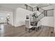 Elegant dining room features modern design with stairs, decor, and wood floors at 19452 Lewis Cir, Westfield, IN 46074