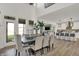 Dining room adjacent to the kitchen features abundant natural light and modern decor at 19452 Lewis Cir, Westfield, IN 46074