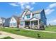 Charming two-story house with lush green lawn, fresh landscaping, and inviting curb appeal at 19452 Lewis Cir, Westfield, IN 46074