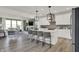 Open concept kitchen with white cabinets, stainless steel appliances, and a large center island at 19452 Lewis Cir, Westfield, IN 46074
