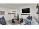 Bright living room with sectional sofa, modern decor, and a mounted flat screen TV at 19452 Lewis Cir, Westfield, IN 46074