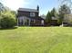 Spacious backyard featuring a sunroom and deck, perfect for entertaining and relaxing at 30 Village Ct, Zionsville, IN 46077