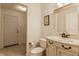 Clean bathroom with a light vanity, toilet and large mirror at 30 Village Ct, Zionsville, IN 46077