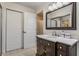 Clean bathroom with a dark brown vanity and large mirror at 30 Village Ct, Zionsville, IN 46077