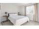 Cozy bedroom with a full-size bed and ample natural light at 30 Village Ct, Zionsville, IN 46077