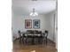 Formal dining room features a large table with seating for six at 30 Village Ct, Zionsville, IN 46077