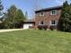 Charming brick home with a well-manicured lawn and attached garage, great curb appeal at 30 Village Ct, Zionsville, IN 46077