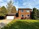 Charming two-story brick home featuring well-manicured lawn and attached two-car garage at 30 Village Ct, Zionsville, IN 46077