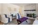Living area with whitewashed brick fireplace and comfortable seating at 30 Village Ct, Zionsville, IN 46077