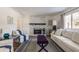Living room featuring a whitewashed brick fireplace and ample natural light at 30 Village Ct, Zionsville, IN 46077