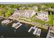 Waterfront homes with docks and boat lifts, showcasing luxurious lakeside living and amenities at 3150 Beach Blvd, Cicero, IN 46034
