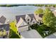 Brick home with manicured lawn, two-car garage, and view of the beautiful lake at 3150 Beach Blvd, Cicero, IN 46034