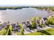 Stunning aerial view of waterfront homes, showcasing lake access and beautiful landscaping at 3150 Beach Blvd, Cicero, IN 46034