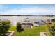 Backyard view of the dock with boat hoist over lake water at 3150 Beach Blvd, Cicero, IN 46034