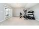 Finished basement with exercise equipment and sliding door at 3150 Beach Blvd, Cicero, IN 46034