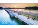 Aerial view of a bridge over water with people enjoying a sunset view at 3150 Beach Blvd, Cicero, IN 46034