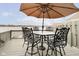 Relaxing lakeside deck with patio furniture, perfect for outdoor dining at 3150 Beach Blvd, Cicero, IN 46034