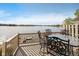 Outdoor deck with table and chairs and view of lake and surrounding landscape at 3150 Beach Blvd, Cicero, IN 46034