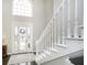Bright entryway with elegant staircase and large front door at 3150 Beach Blvd, Cicero, IN 46034