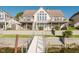 Lakefront home with large windows, balconies, and a private dock for easy water access at 3150 Beach Blvd, Cicero, IN 46034
