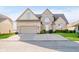 Beautiful brick home with a well-kept lawn and driveway leading to a two-car garage at 3150 Beach Blvd, Cicero, IN 46034