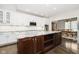 Modern kitchen with white cabinets, granite counters and island at 3150 Beach Blvd, Cicero, IN 46034