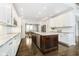 Modern kitchen with white cabinets, granite counters and island at 3150 Beach Blvd, Cicero, IN 46034