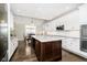 Modern kitchen with white cabinets, granite counters and island at 3150 Beach Blvd, Cicero, IN 46034