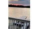 Scenic lake view from the porch featuring a boat dock, showcasing waterfront lifestyle and serene surroundings at 3150 Beach Blvd, Cicero, IN 46034