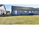 Backyard with a patio and lush green grass, perfect for outdoor activities at 316 Society Dr, Indianapolis, IN 46229