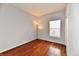 This bedroom has a window that lets in plenty of light and beautiful wood floors at 316 Society Dr, Indianapolis, IN 46229