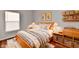 Staged bedroom featuring hardwood flooring and tasteful decor at 316 Society Dr, Indianapolis, IN 46229