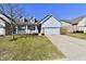 Charming single-Gathering home with a well-manicured lawn and a welcoming front porch at 316 Society Dr, Indianapolis, IN 46229
