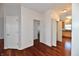 Hallway featuring hardwood floors and multiple doorways at 316 Society Dr, Indianapolis, IN 46229